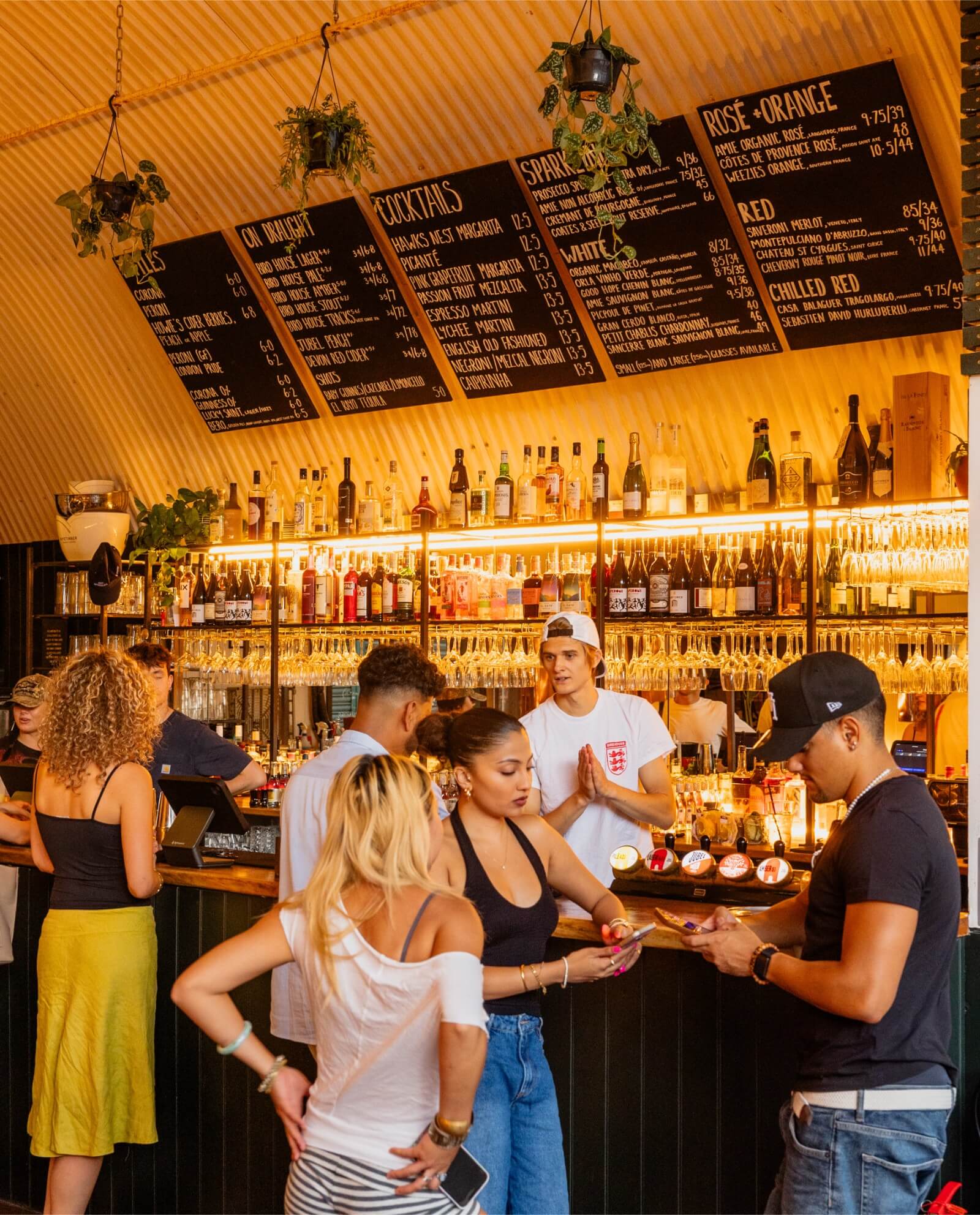 Guests buying drinks at the bar