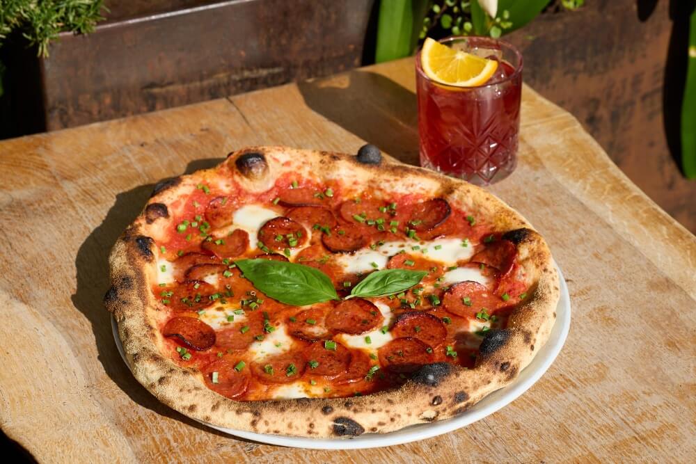 Double pepperoni pizza and negroni
